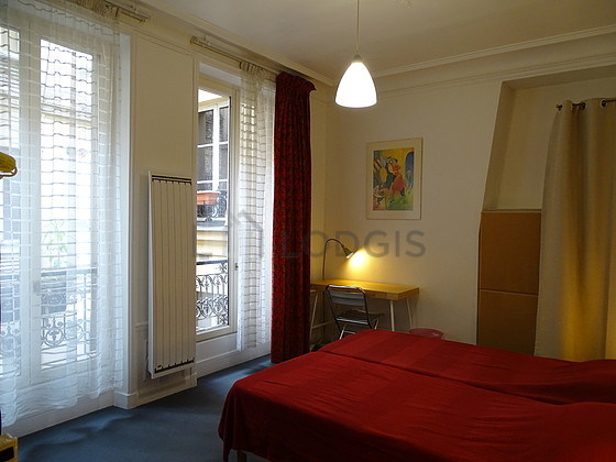 Bedroom with wooden floor