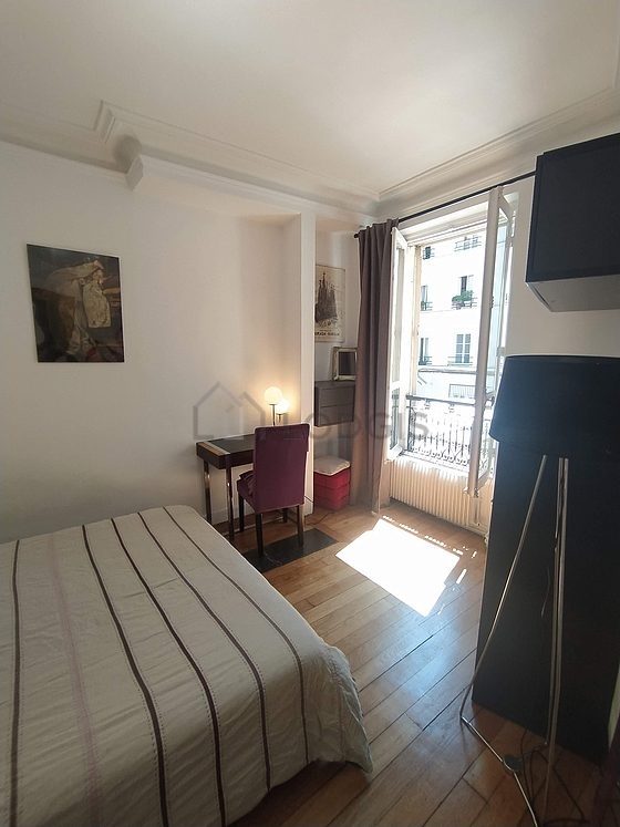 Bedroom with double-glazed windows facing the road