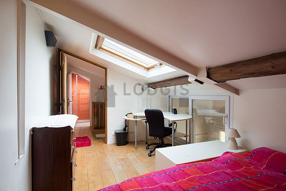 Bedroom with wooden floor