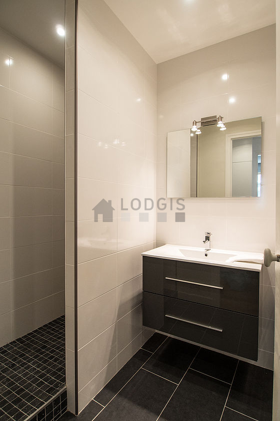 Bathroom equipped with washing machine, bath towels