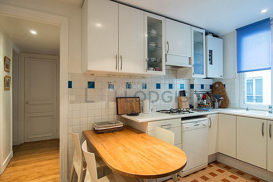 Kitchen where you can have dinner for 3 person(s) equipped with washing machine, dryer, refrigerator, extractor hood