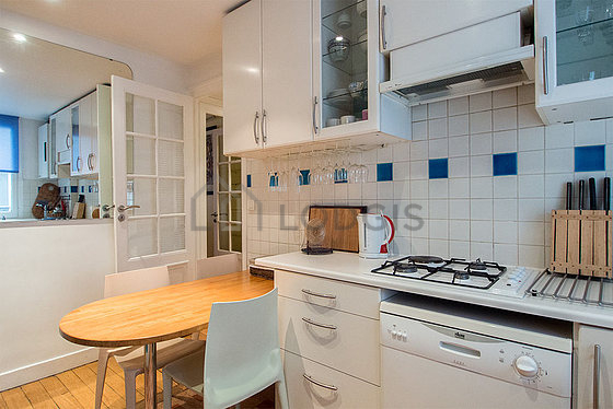 Bright kitchen with double-glazed windows facing the courtyard