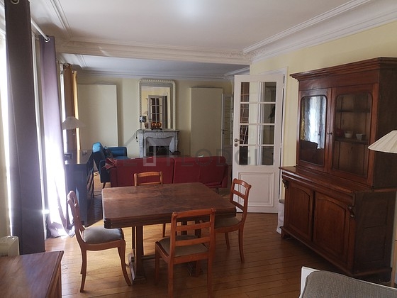 Living room with double-glazed windows facing the road