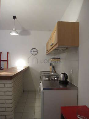 Kitchen where you can have dinner for 2 person(s) equipped with hob, refrigerator, crockery, stool