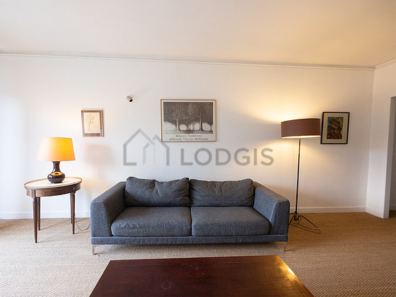 Living room with windows and balcony facing the road