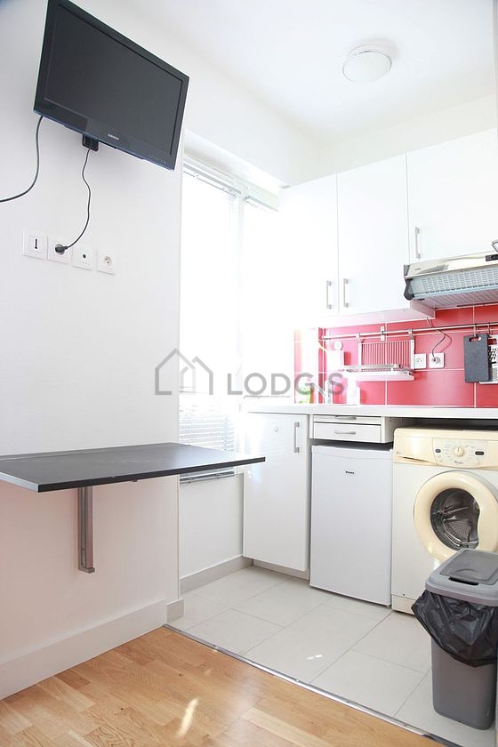 Kitchen equipped with washing machine, refrigerator, freezer, crockery