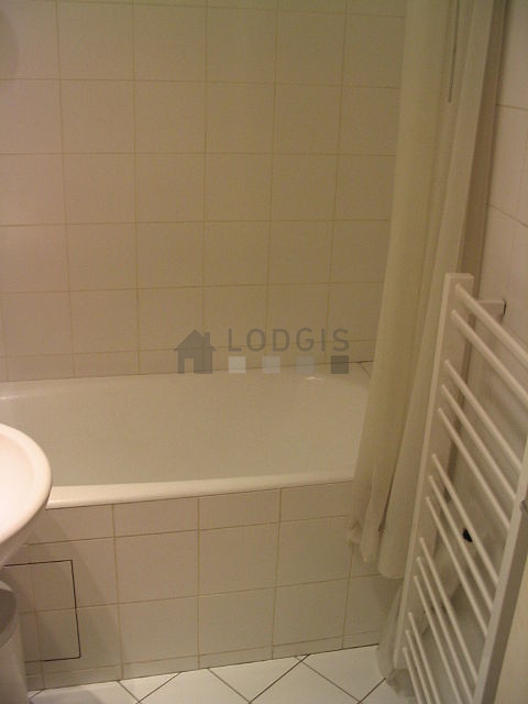 Bathroom equipped with washing machine, cupboard