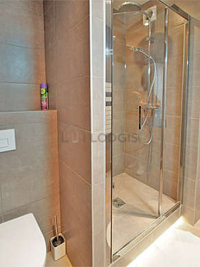 Bathroom equipped with bath tub, shower in bath tub