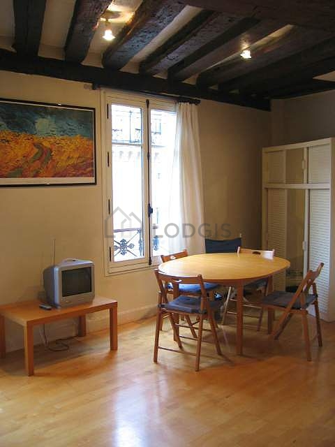 Living room with double-glazed windows facing the road