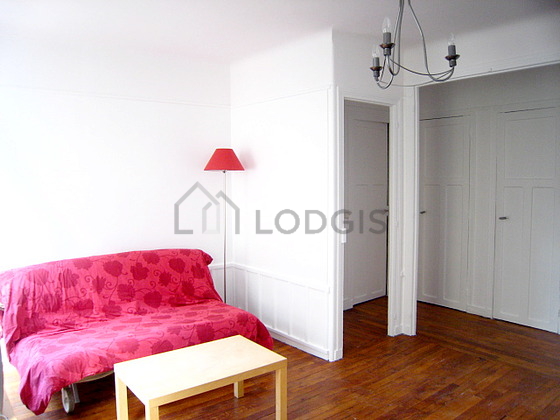 Bright living room furnished with cupboard, 4 chair(s)
