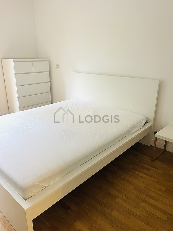 Bedroom with wooden floor