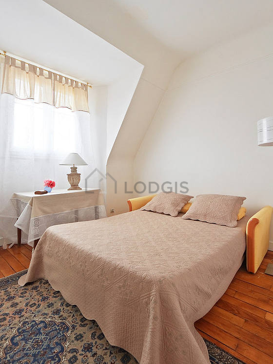 Bedroom with double-glazed windows facing the road