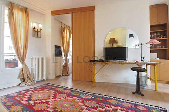 Living room with windows facing the courtyard