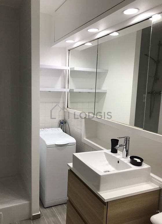 Bathroom equipped with washing machine, bath towels