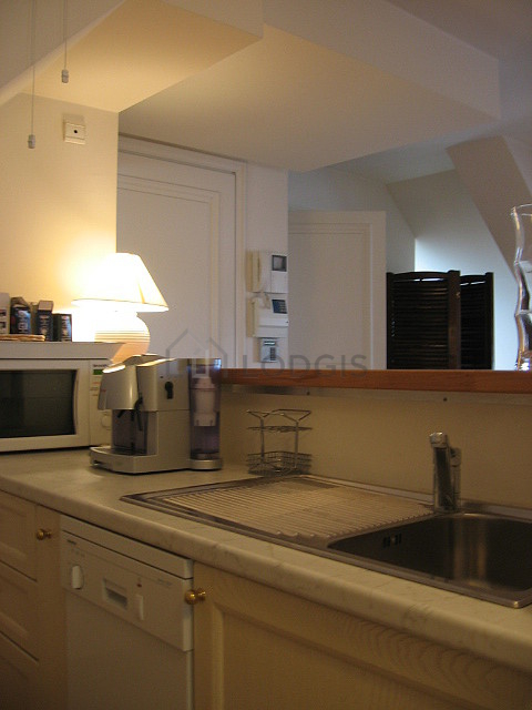 Kitchen where you can have dinner for 2 person(s) equipped with dishwasher, hob, refrigerator, freezer