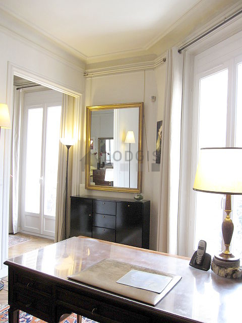 Beautiful office of 15m² with wooden floor furnished with 1 armchair(s)