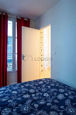 Bright bedroom equipped with wardrobe, cupboard