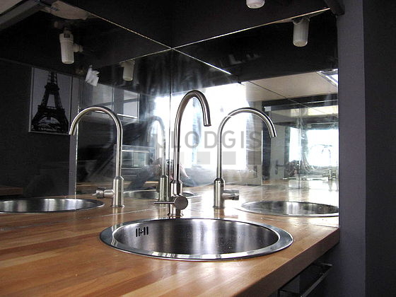 Bright kitchen with double-glazed windows facing the courtyard