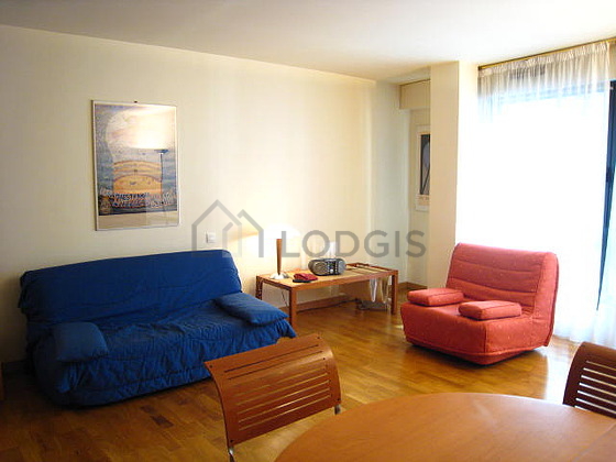 Living room with double-glazed windows facing the road