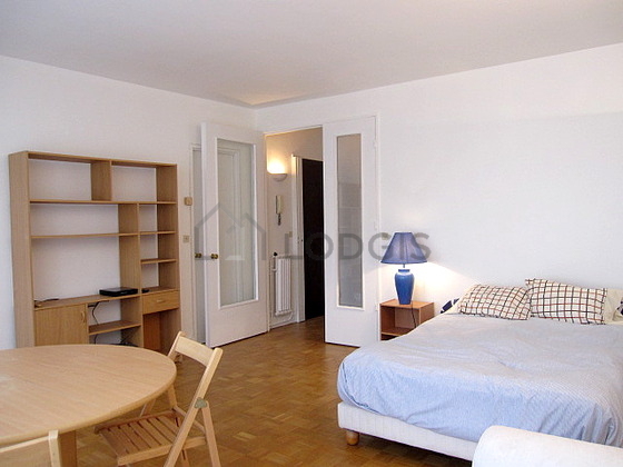 Bright living room furnished with wardrobe, cupboard, 3 chair(s)