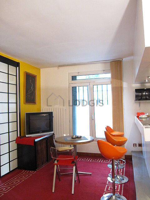 Living room with double-glazed windows facing the road