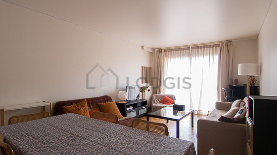Bright living room furnished with 1 armchair(s), 6 chair(s)