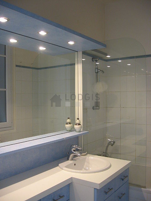 Pleasant bathroom with windows and with tile floor