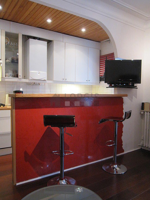 Bright kitchen with double-glazed windows facing the road