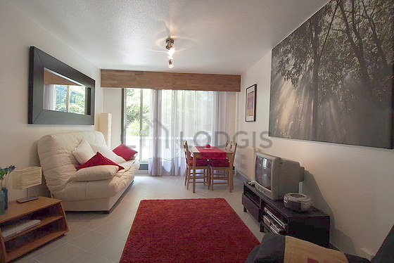 Quiet living room furnished with 2 sofabed(s) of 120cm, tv, fan