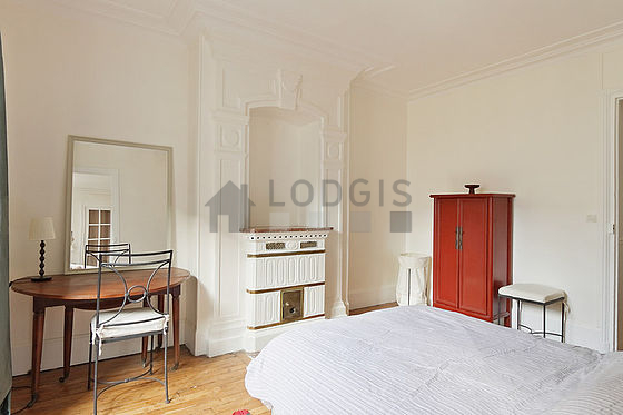 Bedroom with windows facing the road