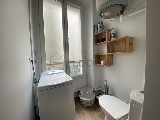 Bathroom equipped with washing machine, bath towels