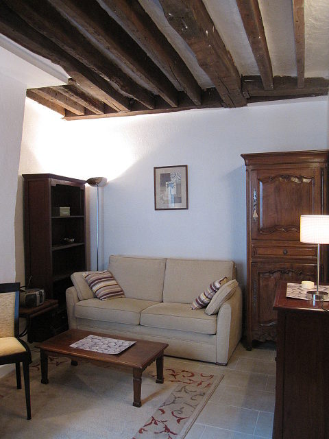 Living room with double-glazed windows facing the courtyard