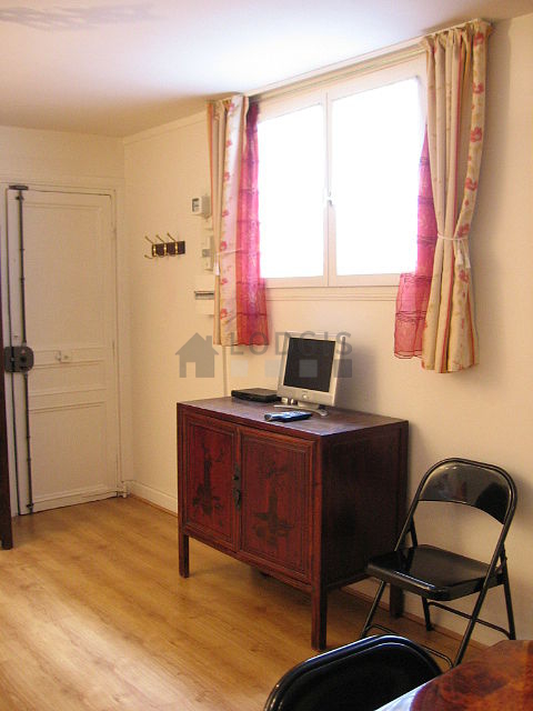 Living room with windows facing the courtyard