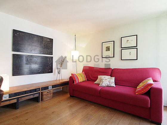Quiet living room furnished with 1 sofabed(s) of 160cm, tv, wardrobe, cupboard