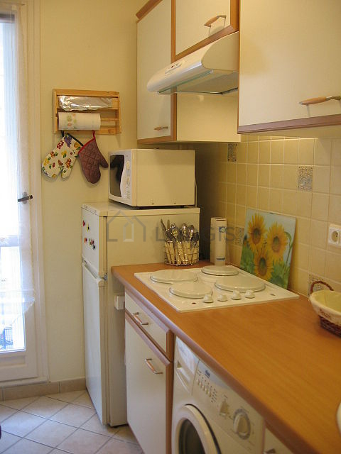 Bright kitchen with windows facing the road