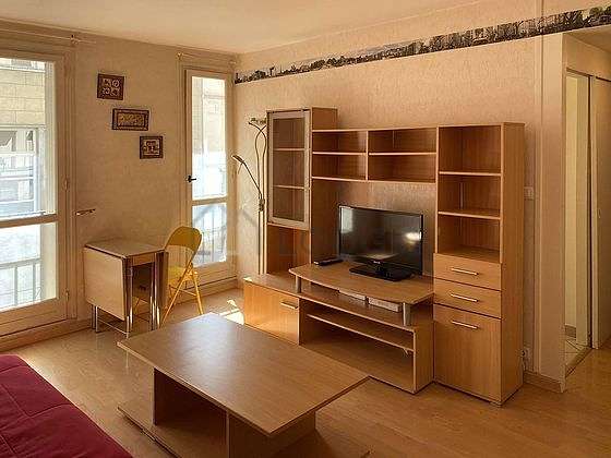 Quiet living room furnished with 1 sofabed(s) of 140cm, tv, wardrobe, cupboard