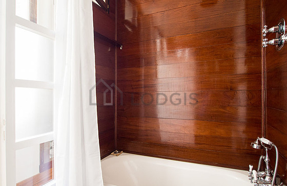 Bathroom equipped with washing machine, bath towels