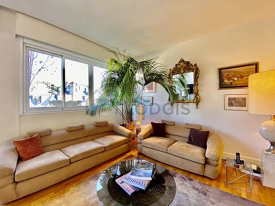 Living room with double-glazed windows facing the road