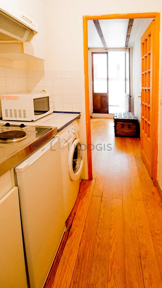 Kitchen equipped with washing machine, refrigerator, freezer, crockery