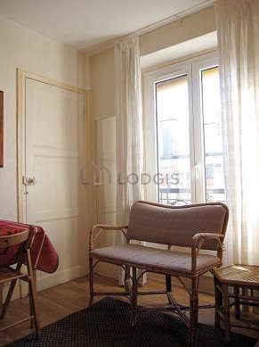 Quiet living room furnished with 1 bed(s) of 90cm, hi-fi stereo, wardrobe, 4 chair(s)