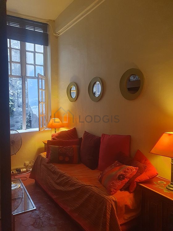 Living room with windows facing the courtyard