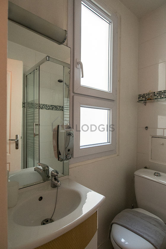 Beautiful and bright bathroom with double-glazed windows and with tile floor