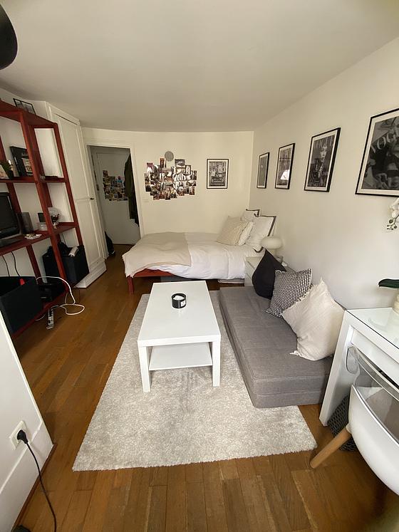 Quiet living room furnished with 1 bed(s) of 120cm, tv, wardrobe, cupboard