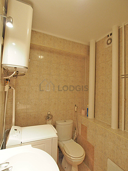 Bathroom equipped with washing machine, bath towels