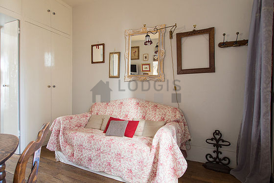 Quiet living room furnished with 1 sofabed(s) of 140cm, tv, wardrobe, cupboard