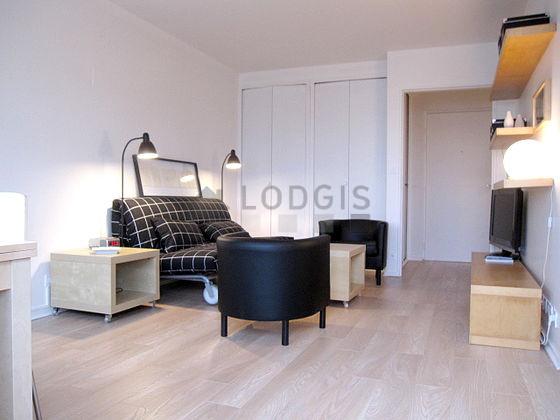 Living room furnished with 1 sofabed(s) of 140cm, tv, wardrobe, cupboard