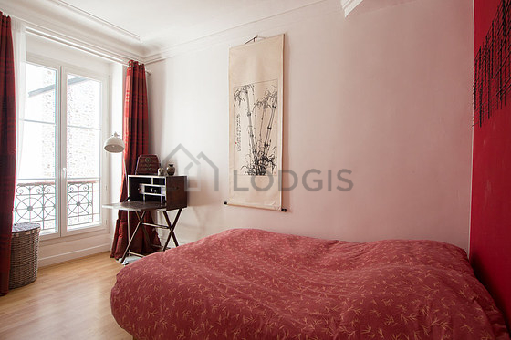 Bedroom with wooden floor