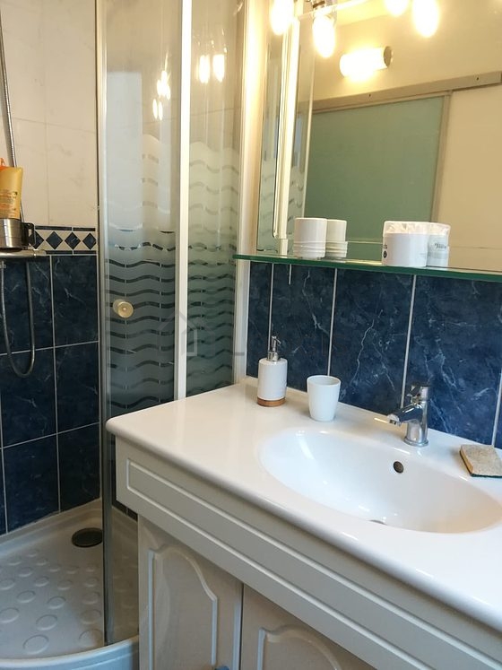 Bathroom equipped with washing machine, bath towels