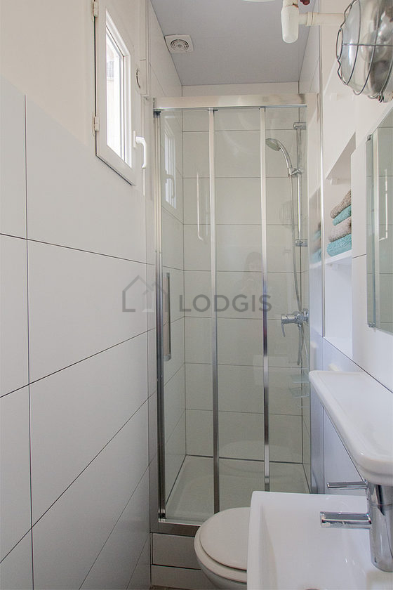 Beautiful and bright bathroom with double-glazed windows and with tile floor