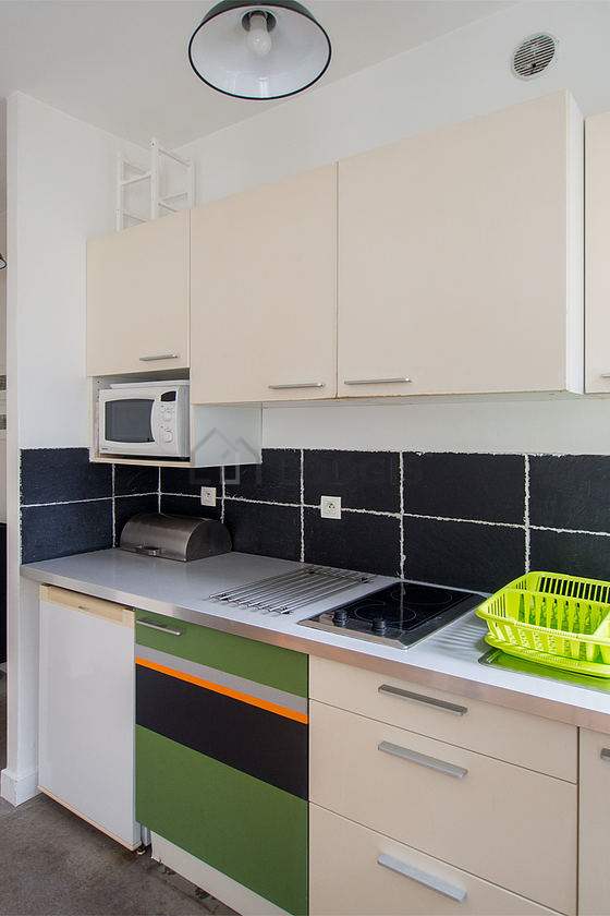 Kitchen equipped with washing machine, refrigerator, freezer, crockery